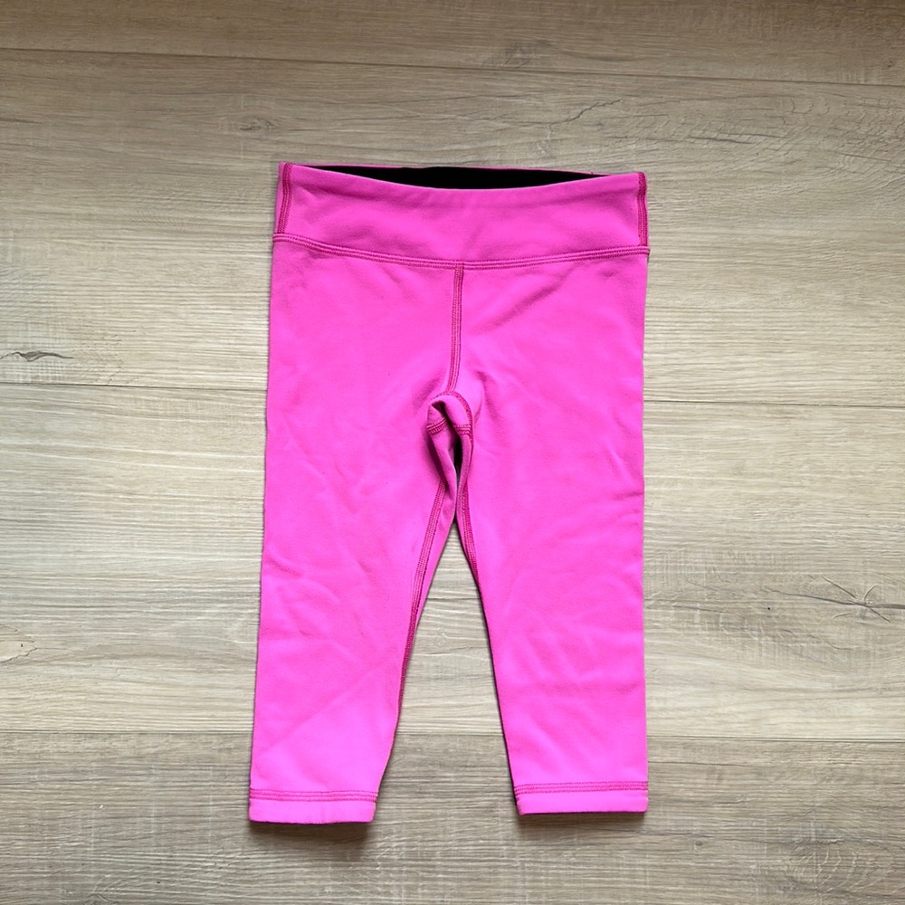 Ivivva reversible pink and black leggings, child size 4, in great condition.